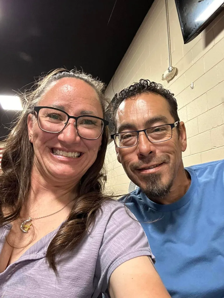 Jessica McClure Morales and her husband Daniel Morales smiling.