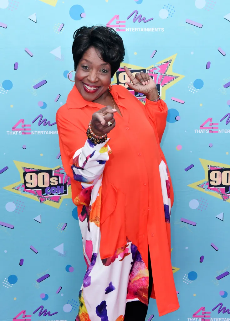 Jo Marie Payton smiling and pointing at the camera while attending 90s Con.