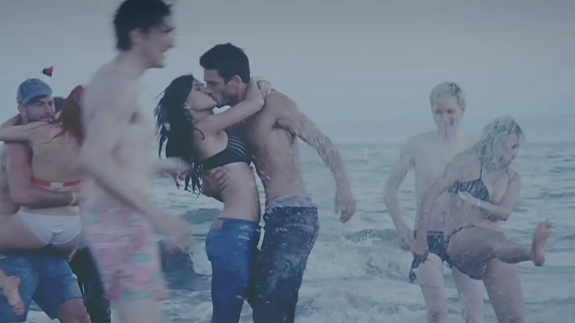 Josh Kloss embracing Katy Perry in the music video for 