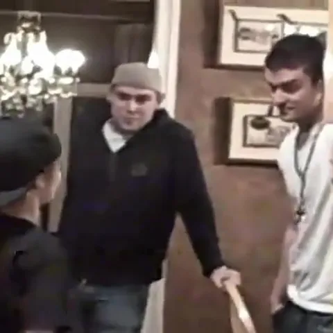 Justin Timberlake (left) and Justin Bieber (right) standing together in a room.