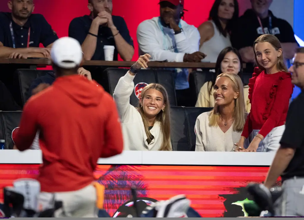 Kai Trump and her mother Vanessa Trump laugh during a break in a match.