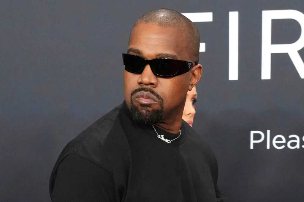 Kanye West wearing sunglasses at the 67th annual Grammy Awards.