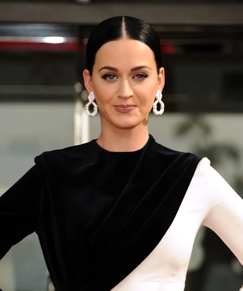 Katy Perry in a black and white dress at an event.