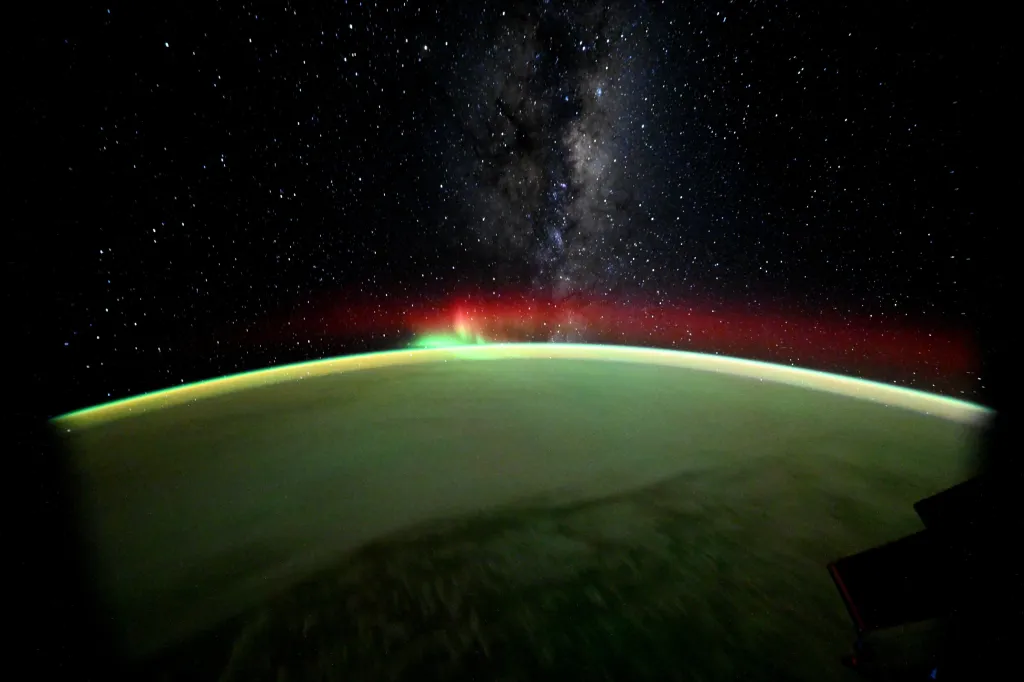 Aurora and the Milky Way seen from orbit.