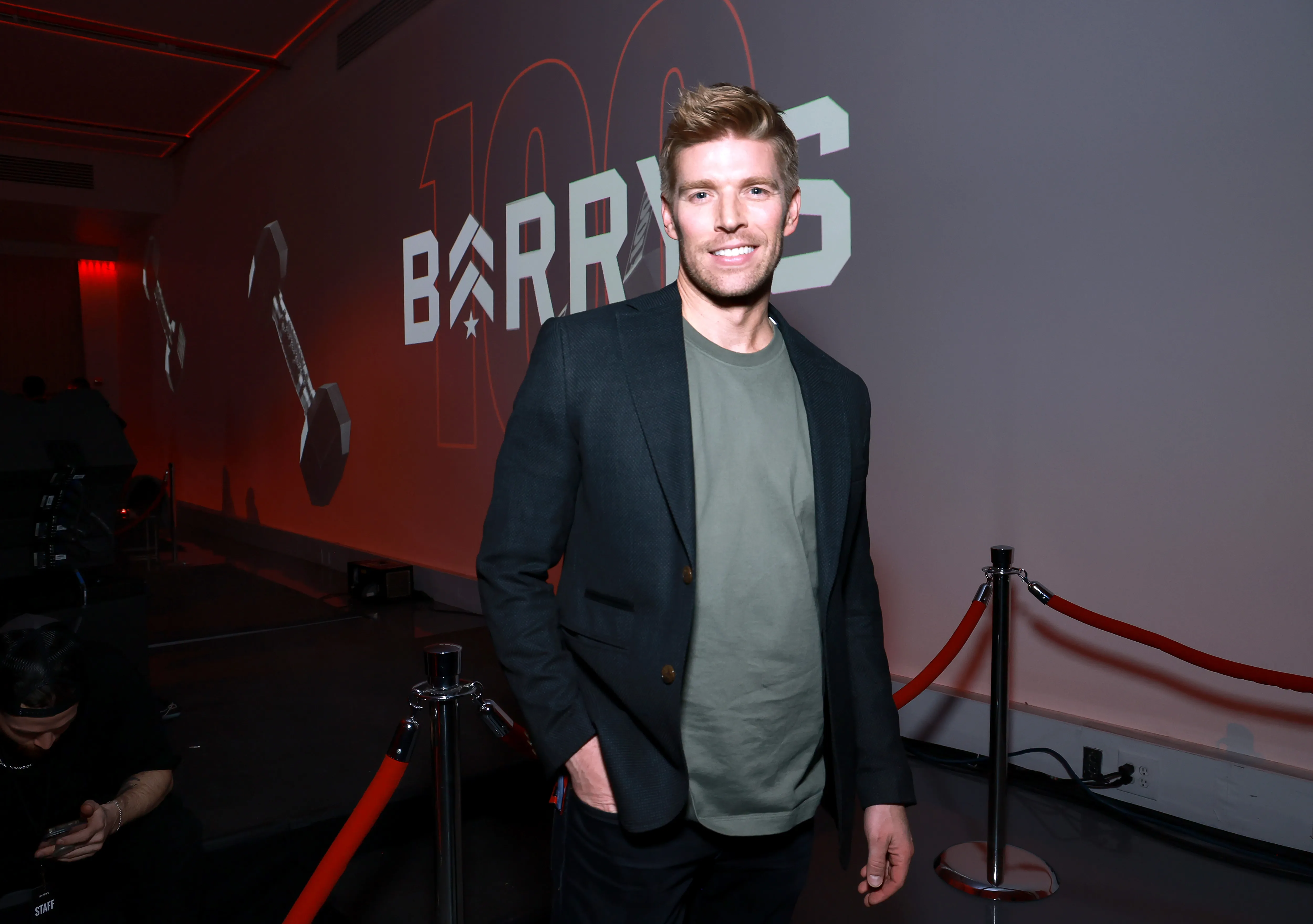 Kyle Cooke smiles at Barry's 100th Studio Milestone Celebration.