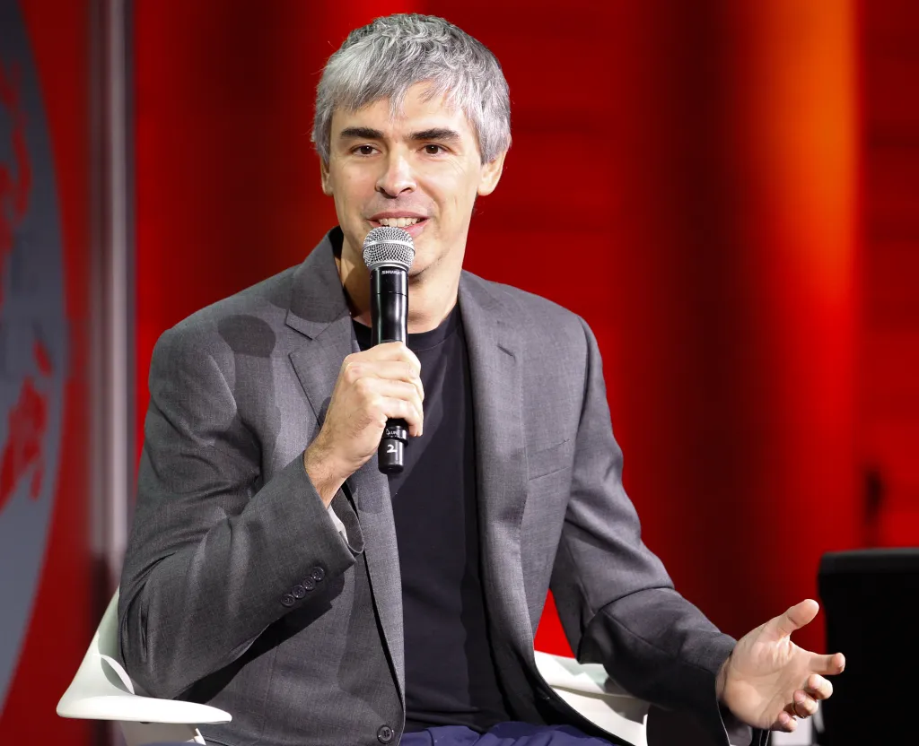 Larry Page speaking into a microphone.