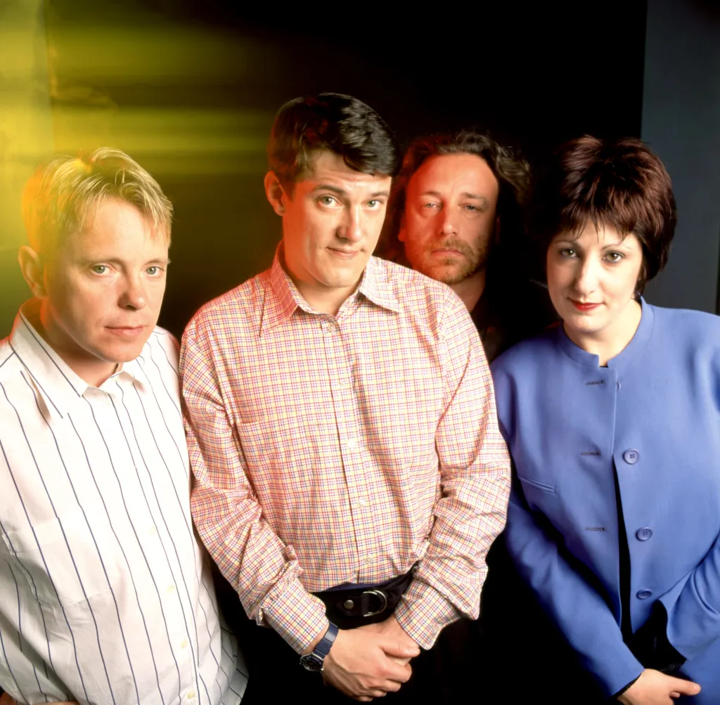 Portrait of New Order band members, Bernard Sumner, Stephen Morris, Peter Hook, and Gillian Gilbert.