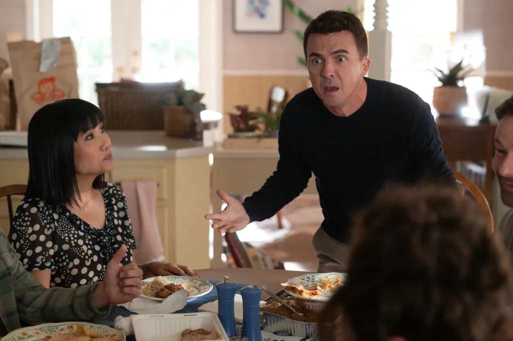 Frankie Muniz looking surprised at the dinner table with Emy Coligado.