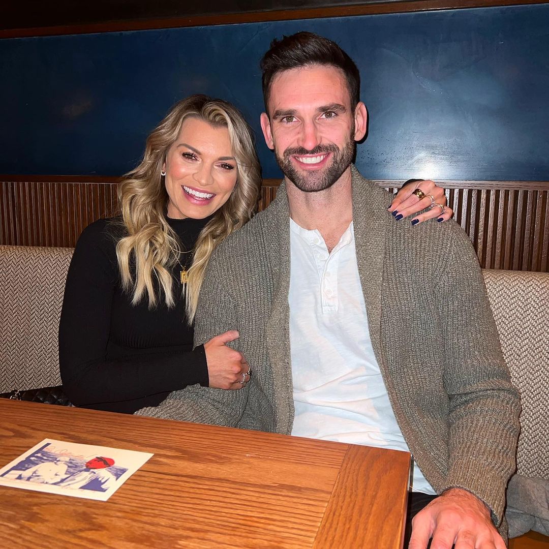 Lindsay Hubbard and Carl Radke smiling at a table.