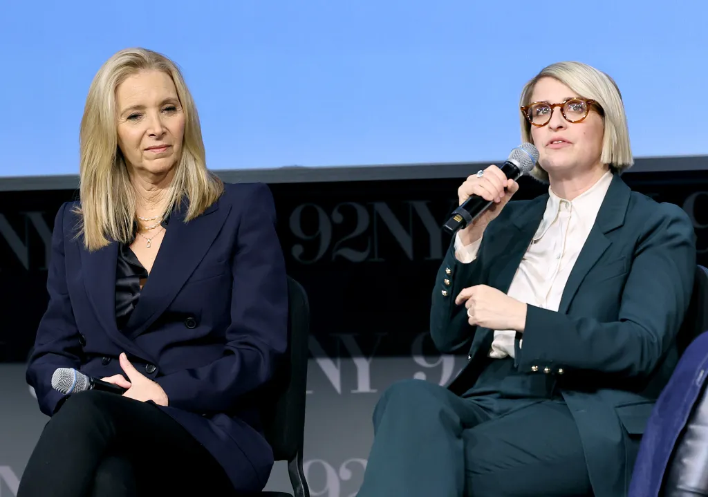 Lisa Kudrow and Liz Feldman sitting on stage.