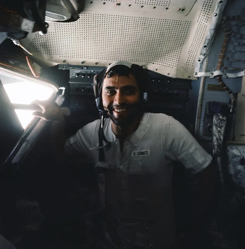 Astronaut Harrison H. Schmitt, lunar module pilot, with a beard, smiles inside the Lunar Module prior to its liftoff from the moon's surface.