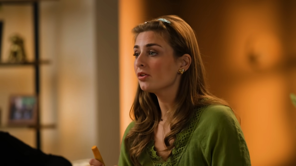 Abbey Romeo speaking while holding a yellow item.