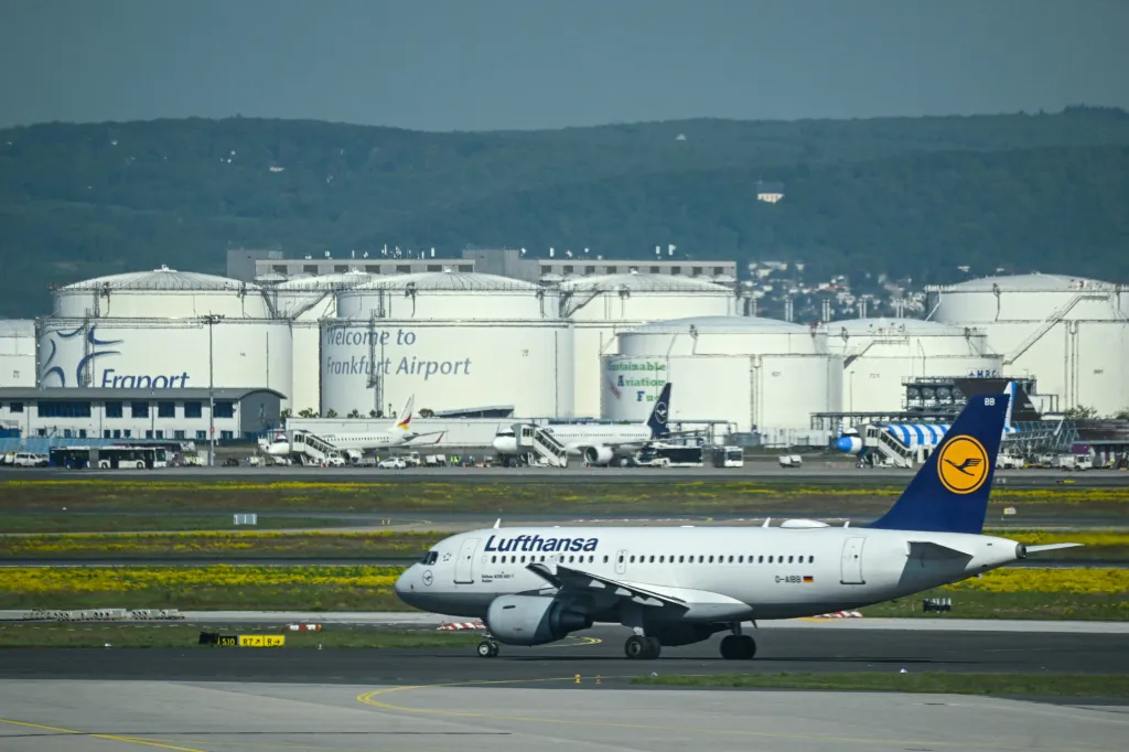 A Lufthansa plane on a runway near kerosene tanks at Frankfurt Airport.
