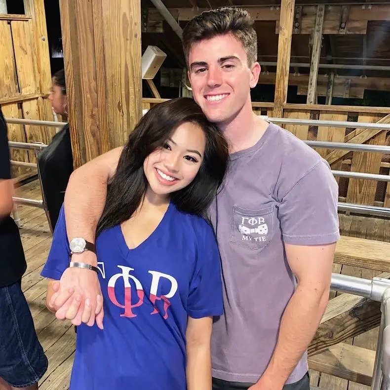 Luke Gradl and his wife Sarah Danh smiling.