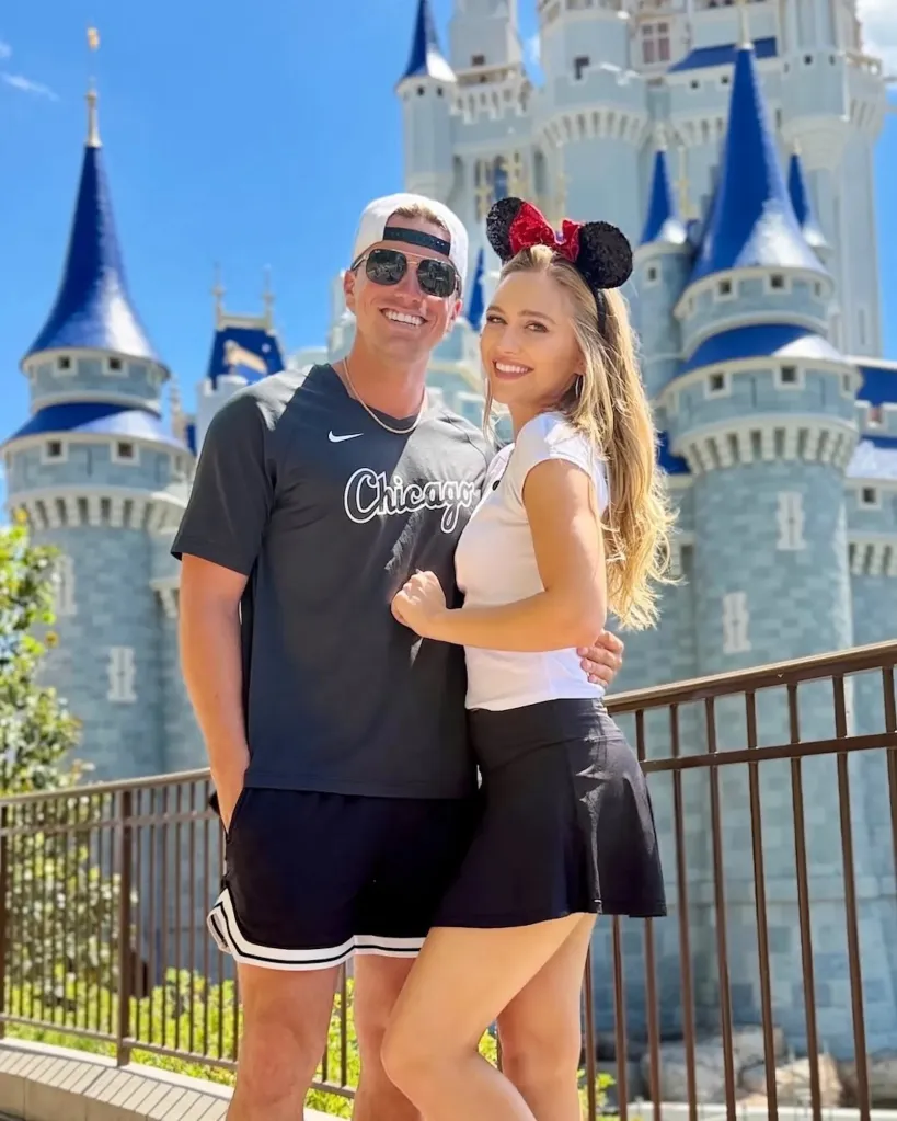 Maggie Sajak with a man in front of Cinderella Castle.