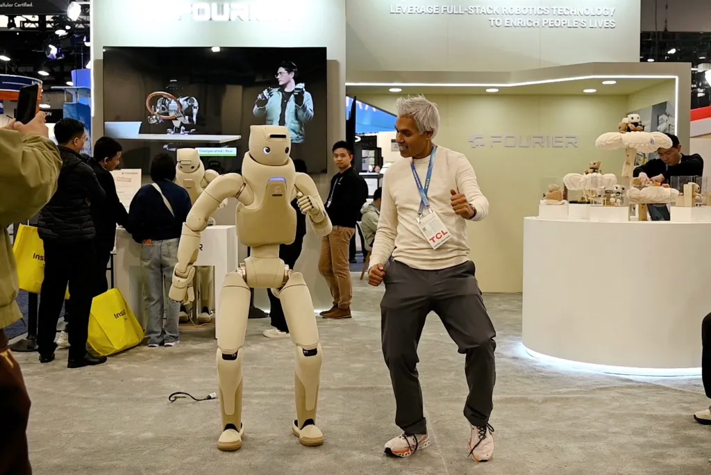 A man dances with a Fourier GR-3 robot at CES 2026.