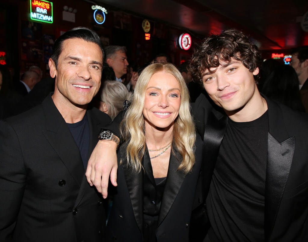 Mark Consuelos, Kelly Ripa, and Joaquin Consuelos smiling at the opening night after party for 