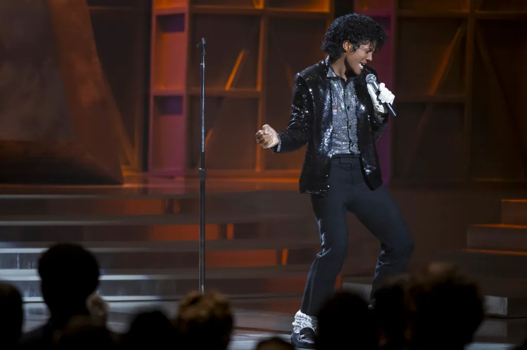 Jaafar Jackson as Michael Jackson performing on stage.