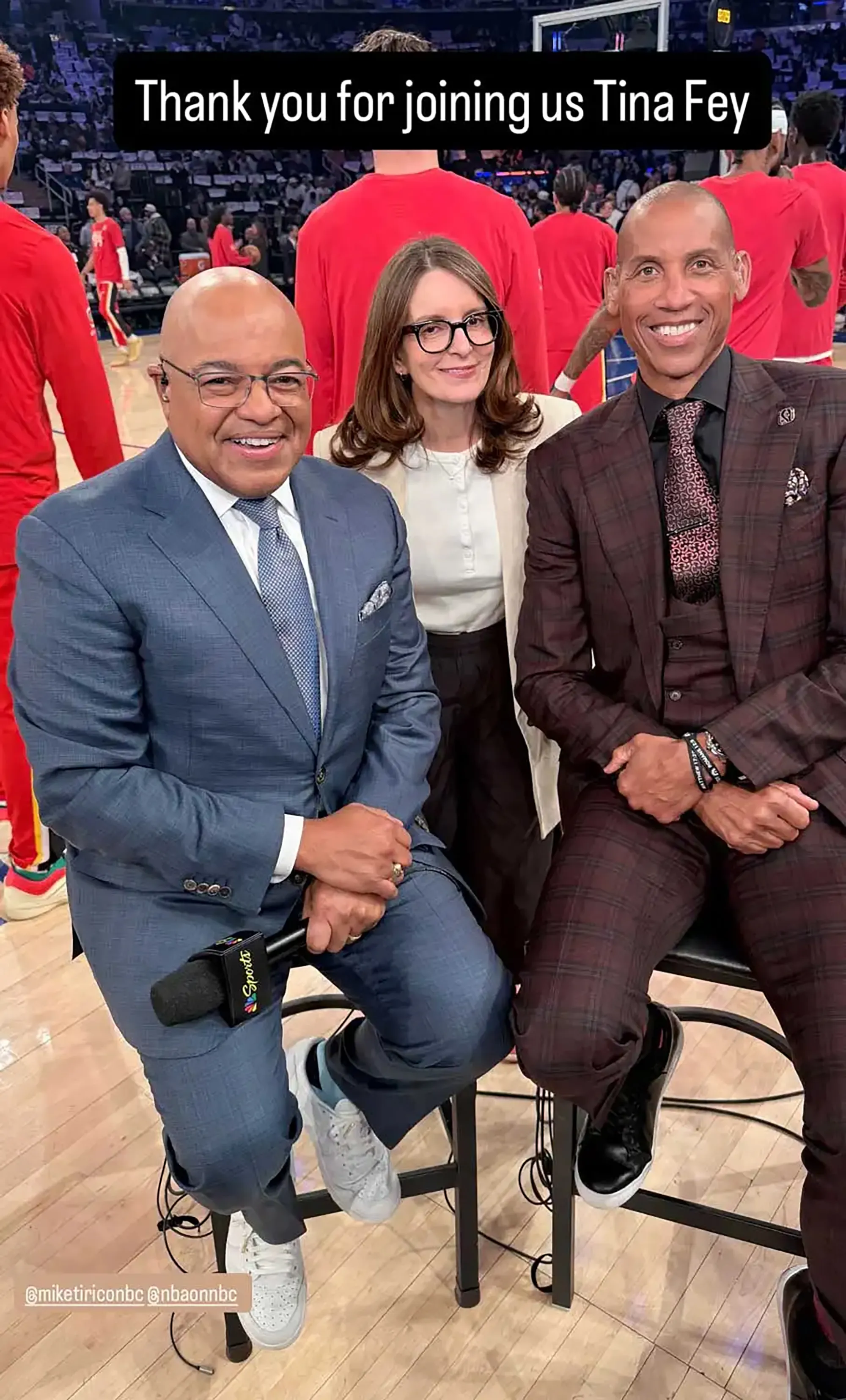 Mike Tirico, Tina Fey, and Reggie Miller pose at Game 5 of the Knicks-Hawks series.