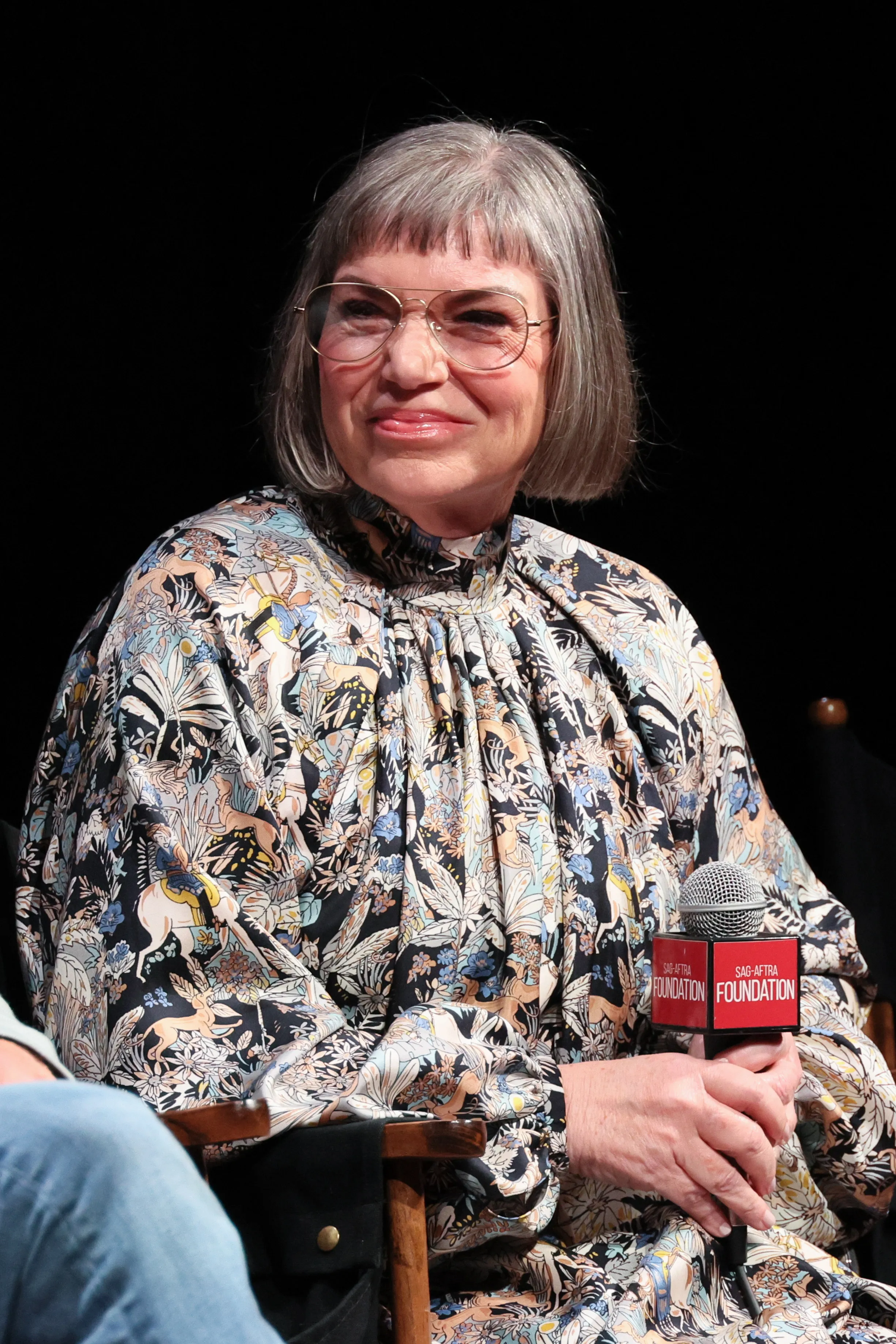 Mindy Cohn smiling while speaking onstage at SAG-AFTRA Foundation Conversations - 