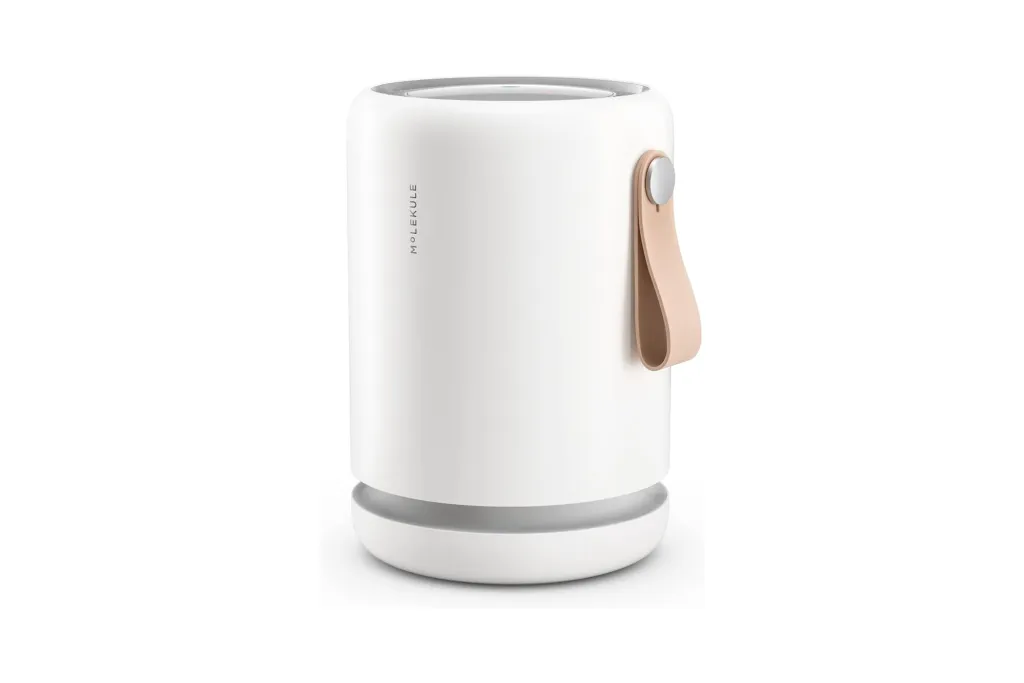 A white cylindrical object with a leather strap