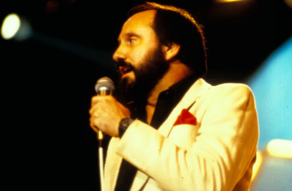 Musician Ray Stevens performing with a microphone.