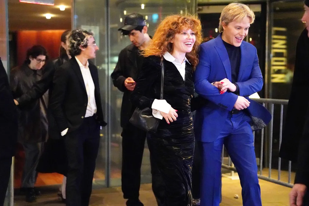 Natasha Lyonne, in a black coat and white shirt, leaving an afterparty for the Lorne Michaels movie