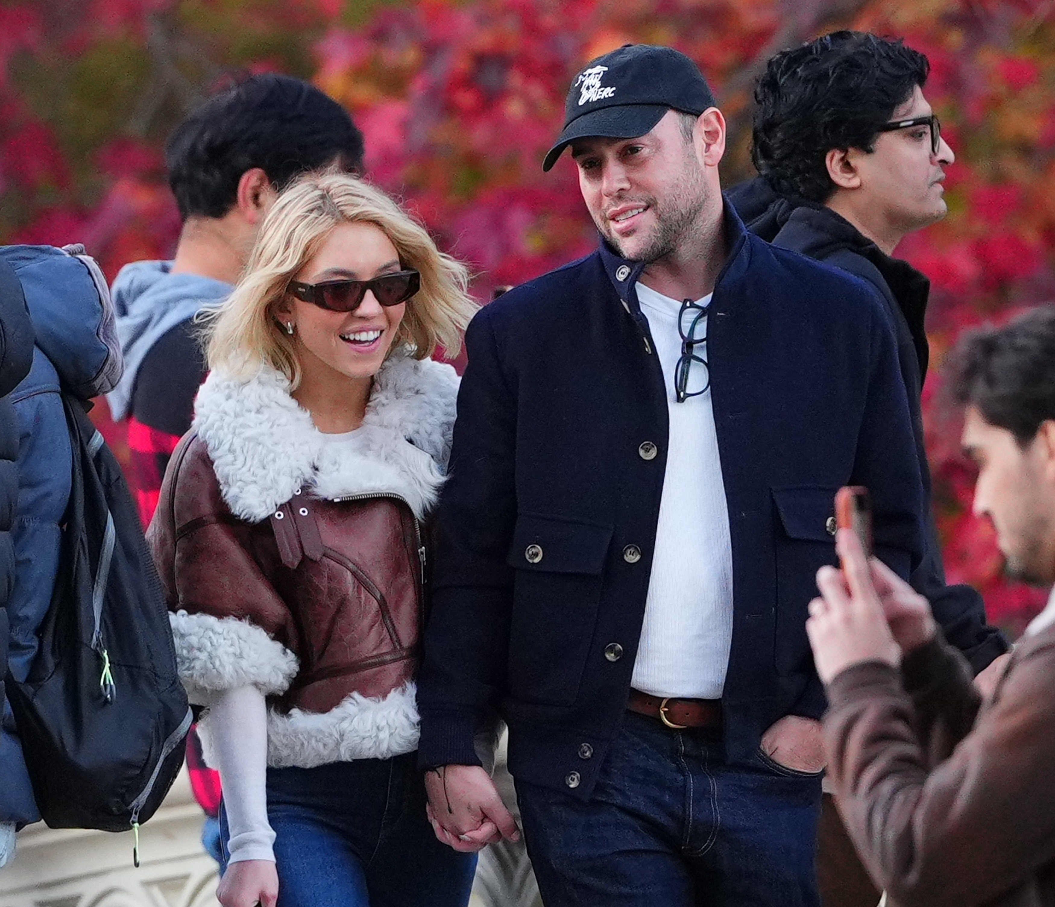 Sydney Sweeney and Scooter Braun walking hand-in-hand in Central Park.