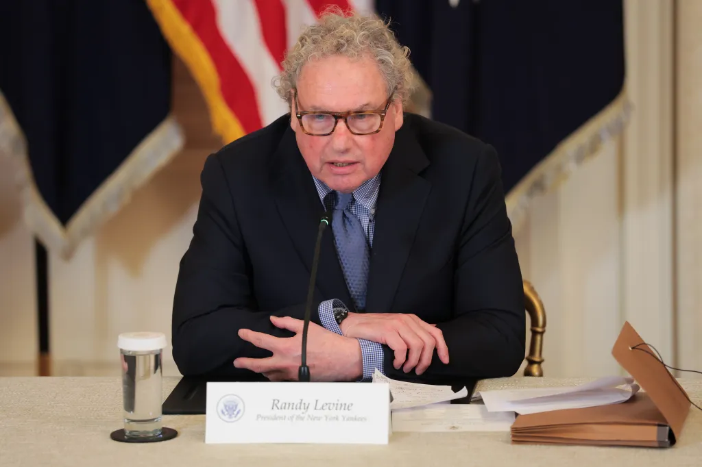 Randy Levine speaking at a college sports roundtable in the East Room of the White House.