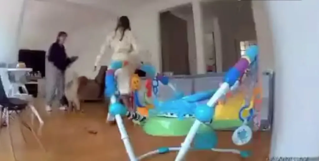 Security footage of a woman being fatally shot in an apartment.