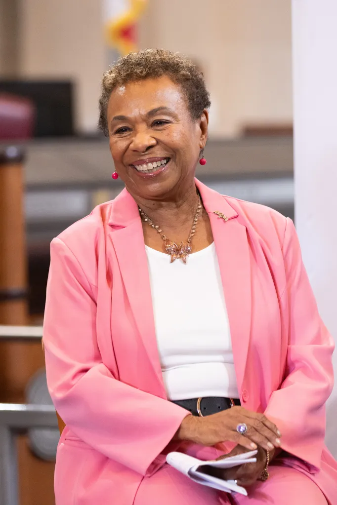 Oakland Mayor Barbara Lee smiling during a press conference.