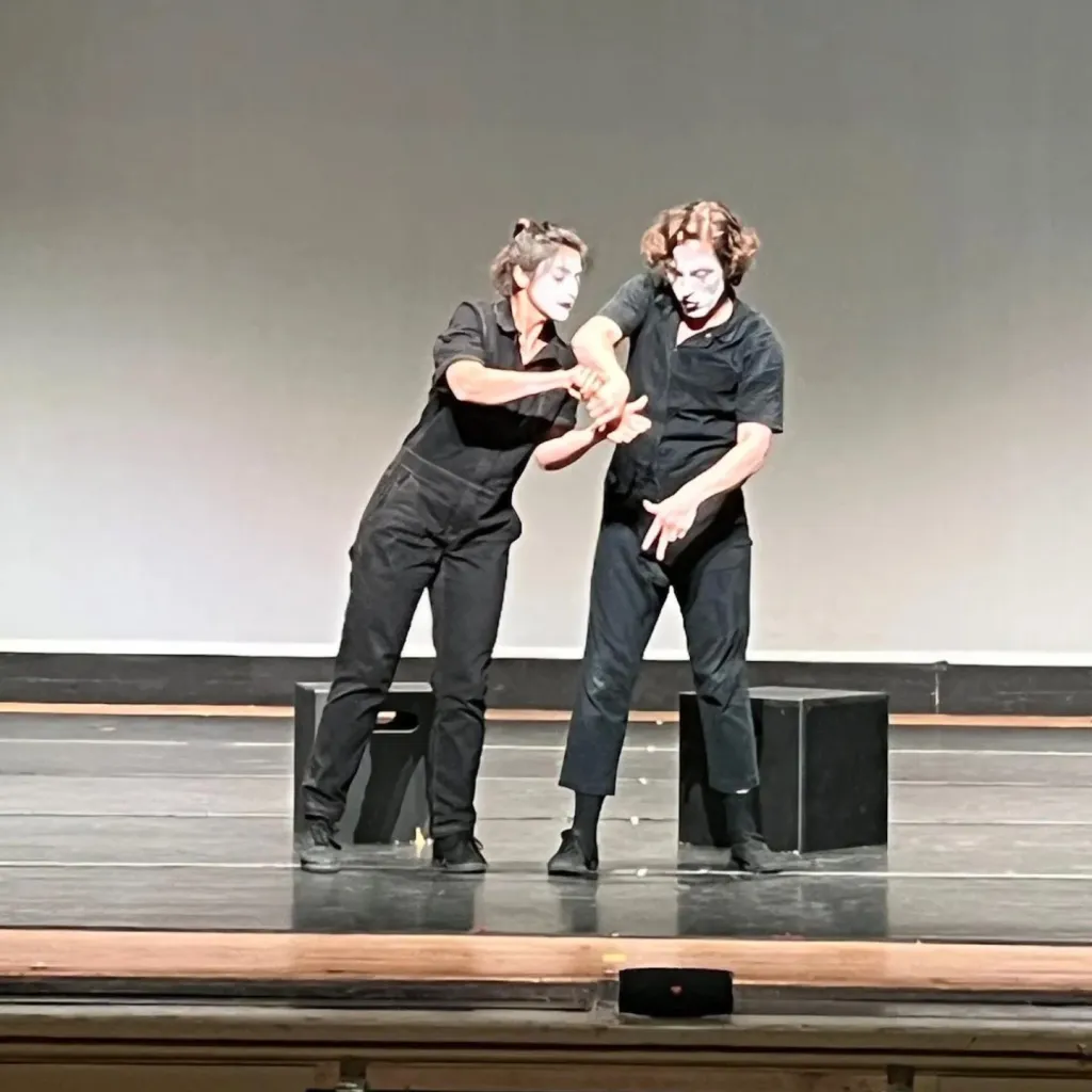 David Jenkins and another mime performing on stage.