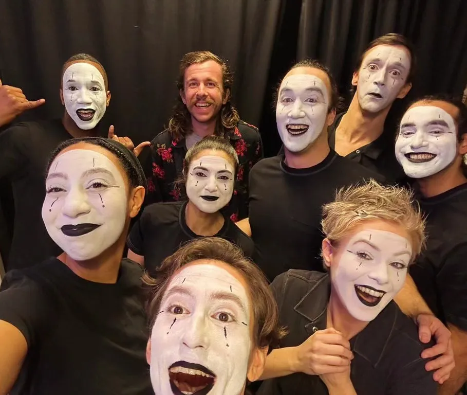 David Jenkins and a group of people wearing mime makeup.