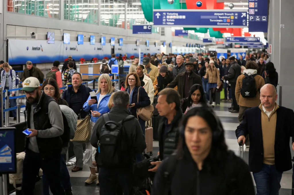 Passengers walk through the terminal at Chicago O'Hare on Nov. 26, 2025.