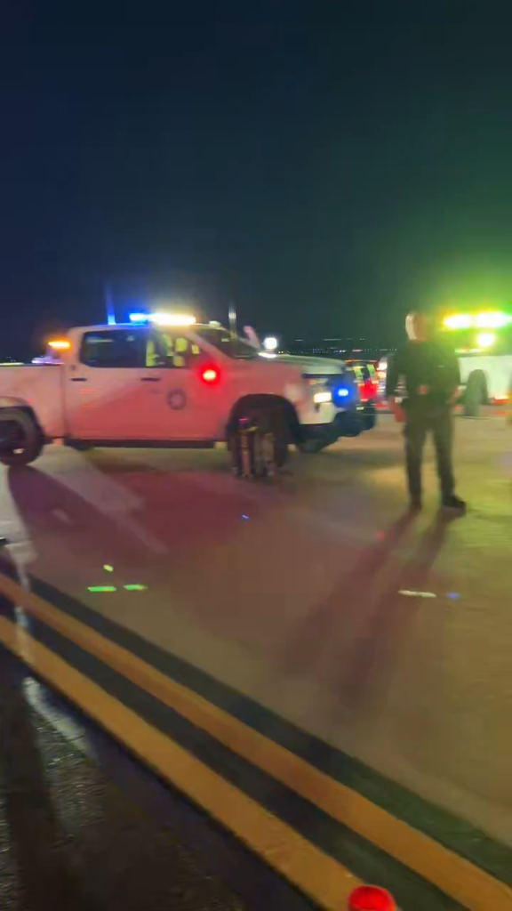 Emergency crews attending to a plane after a bomb threat was reported.