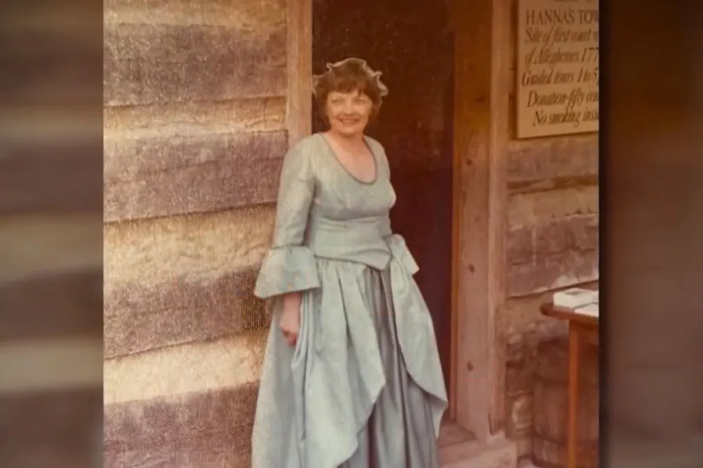 Peggy Fields smiling in a period costume at Hanna's Town.