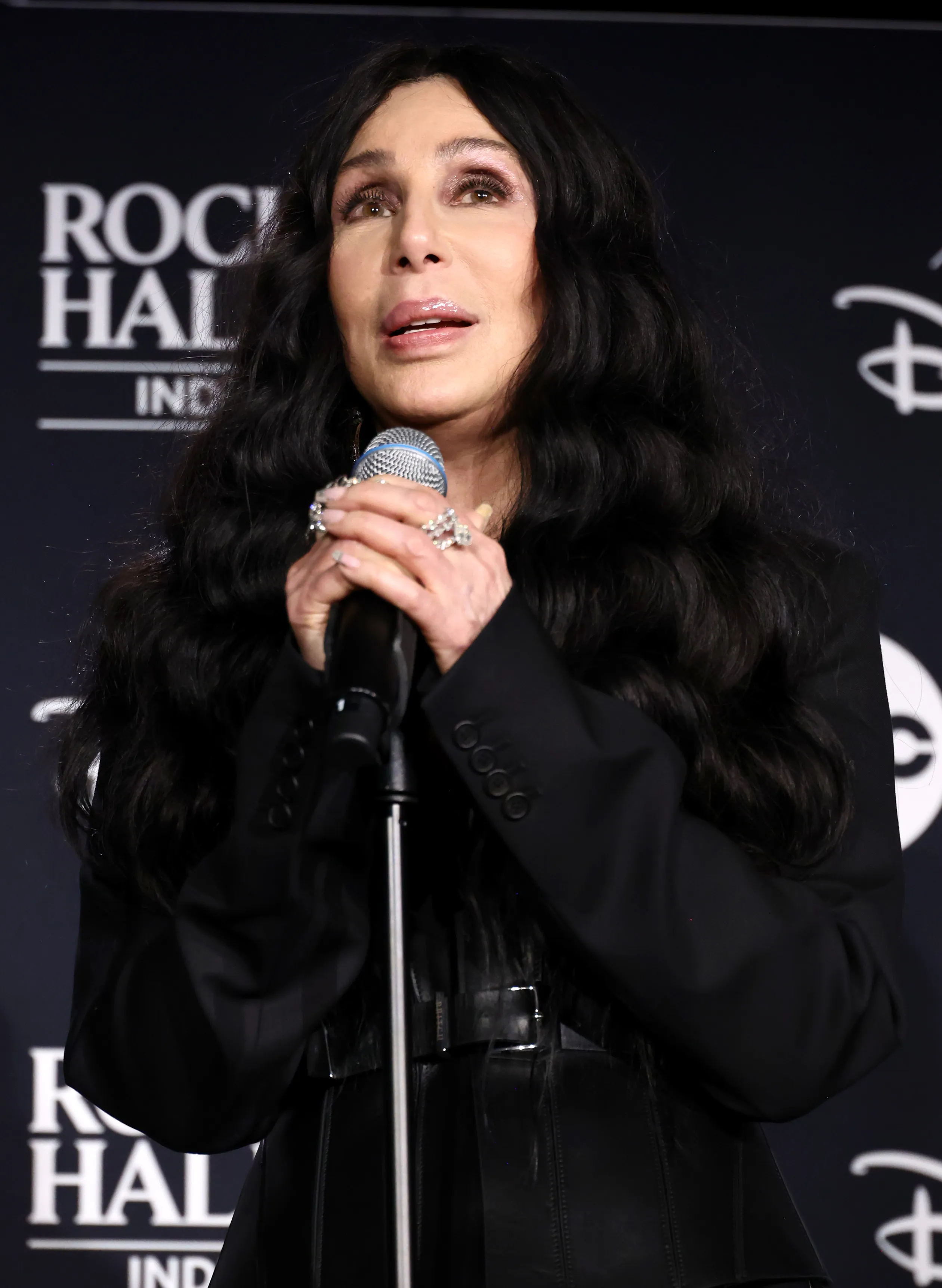 Cher speaking at the 2024 Rock & Roll Hall of Fame Induction Ceremony.