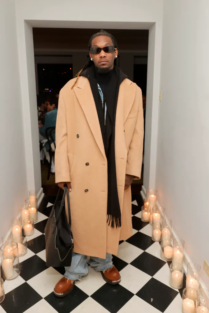 Offset at the GQ Men of the Year Party 2023 VIP dinner, wearing a camel-colored coat and sunglasses.