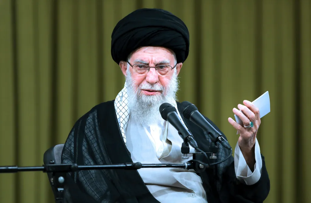 Supreme Leader Ayatollah Ali Khamenei speaking at a ceremony.