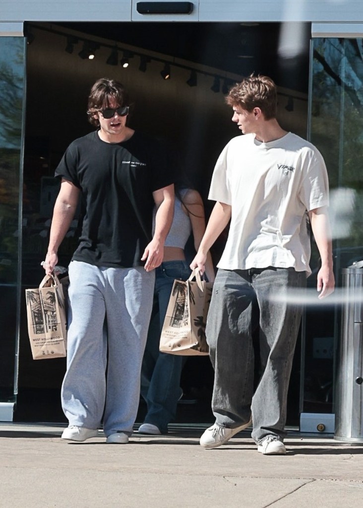 Jayden Federline and Sean Preston Federline exiting Erewhon Market with shopping bags.