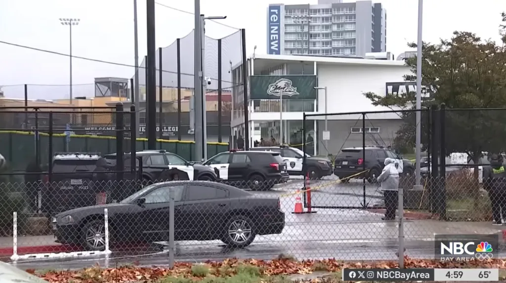 Police vehicles are present at the scene of a deadly shooting at Laney College in Oakland, Calif.