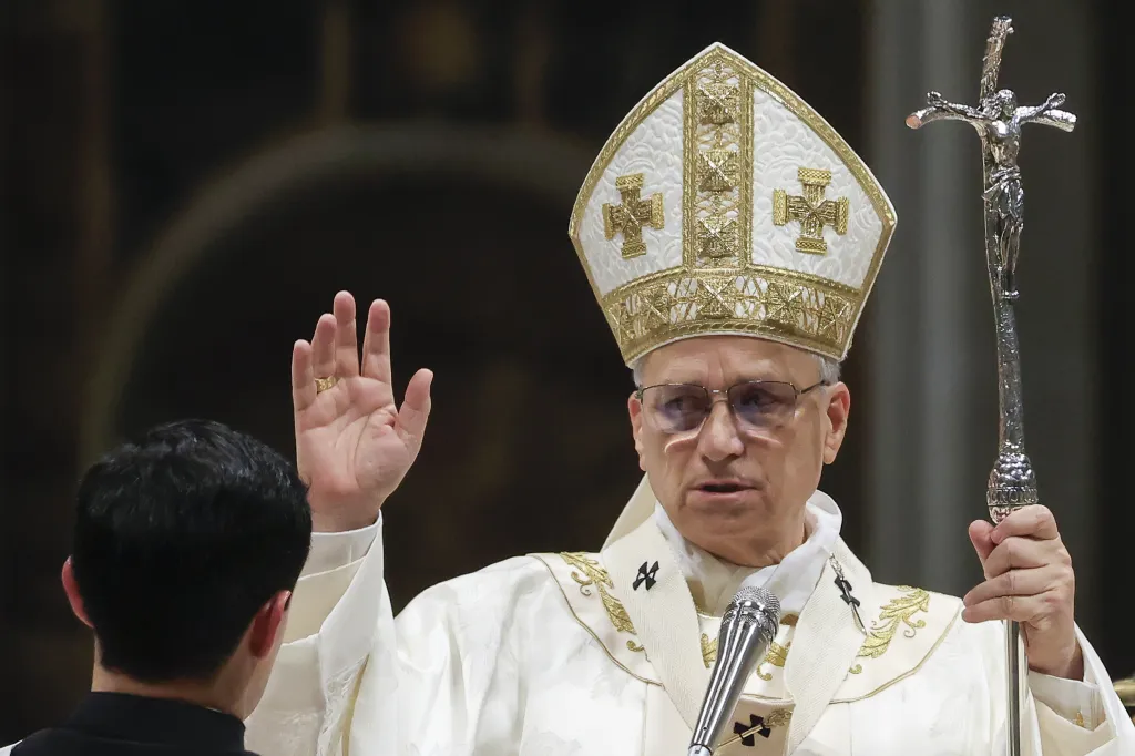 Pope Leo XIV delivers a blessing during the Easter Vigil in St. Peter's Basilica.