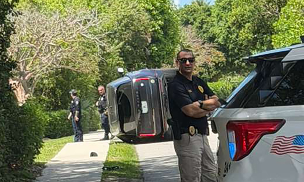 Tiger Wood's car is seen turned on its side following a crash in Florida.