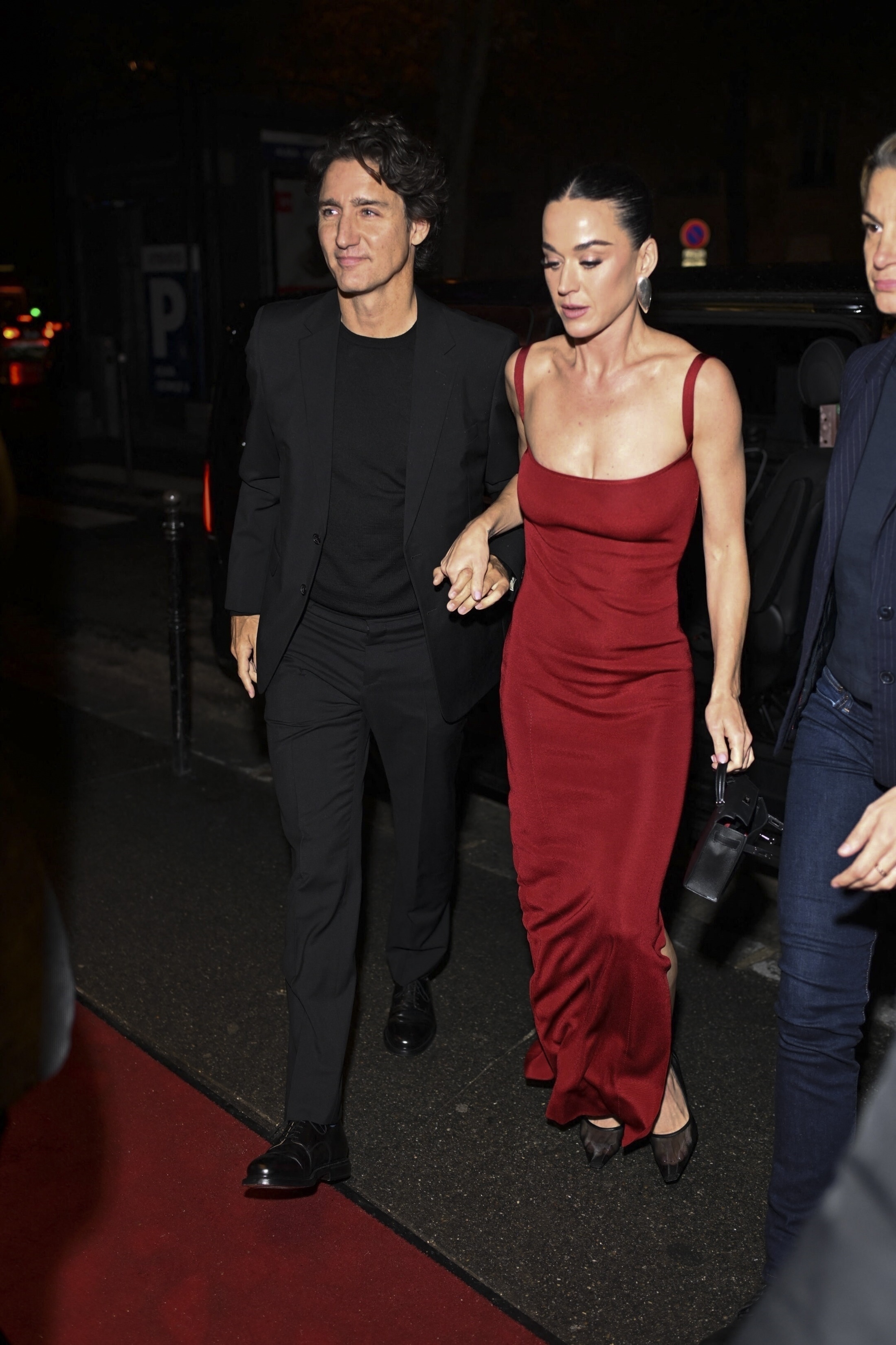 Katy Perry and Justin Trudeau holding hands while arriving at Crazy Horse Paris.