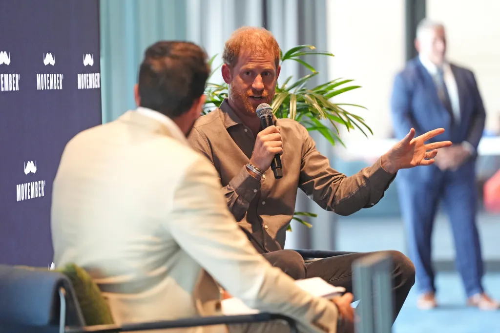 Prince Harry speaking into a microphone during a Q&A session for Movember.