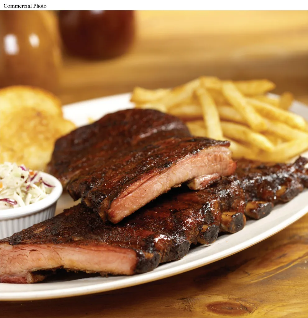 Smokey Bones ribs with fries, coleslaw, and toast.