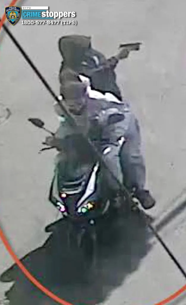 Surveillance photo of two individuals on a scooter, one in a hoodie holding a gun.