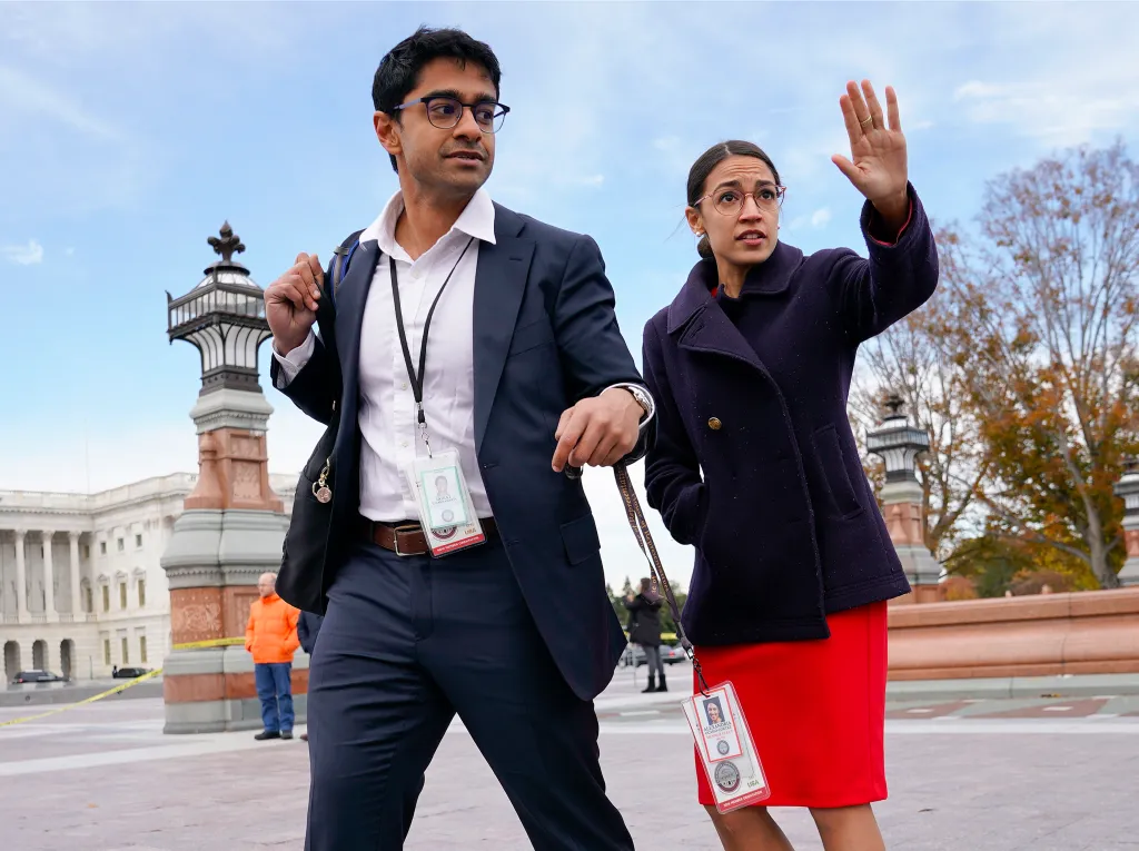 Rep.-elect Alexandria Ocasio-Cortez and her chief of staff Saikat Chakrabarti walk together on Capitol Hill.