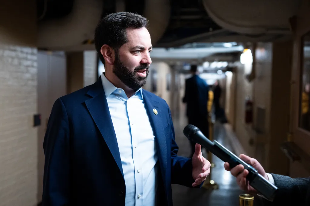 Rep. Mike Lawler speaking into a microphone.