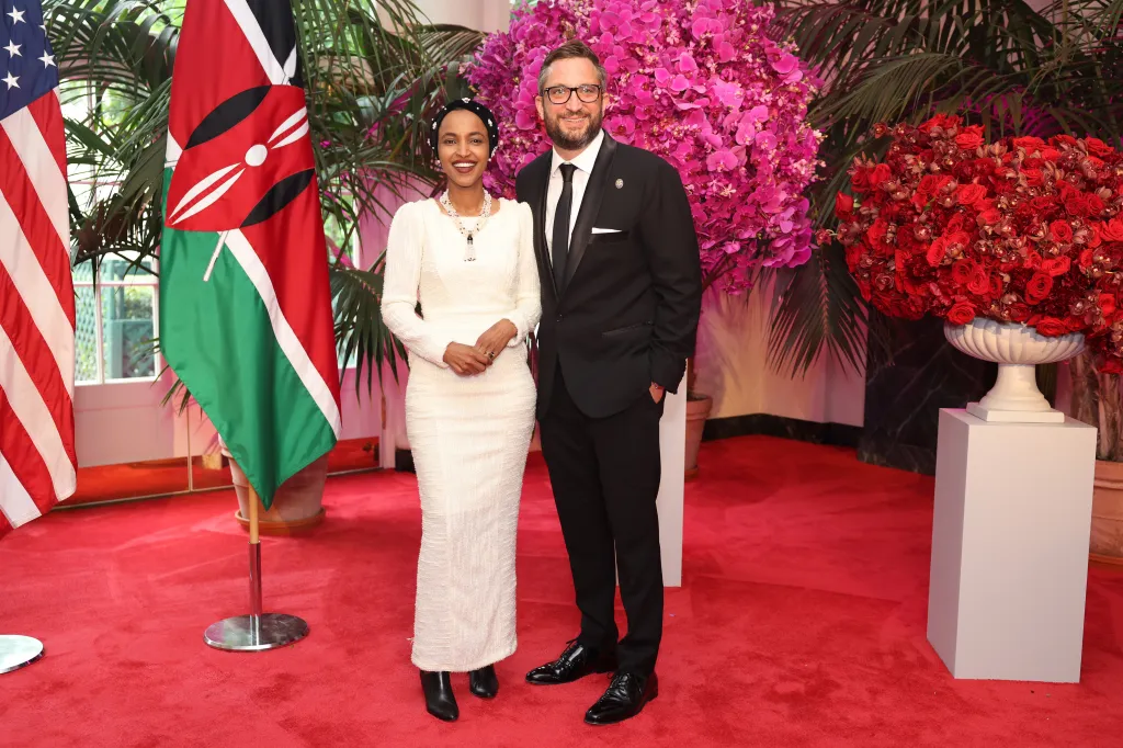 Representative Ilhan Omar and Tim Mynett attend a state dinner at the White House.